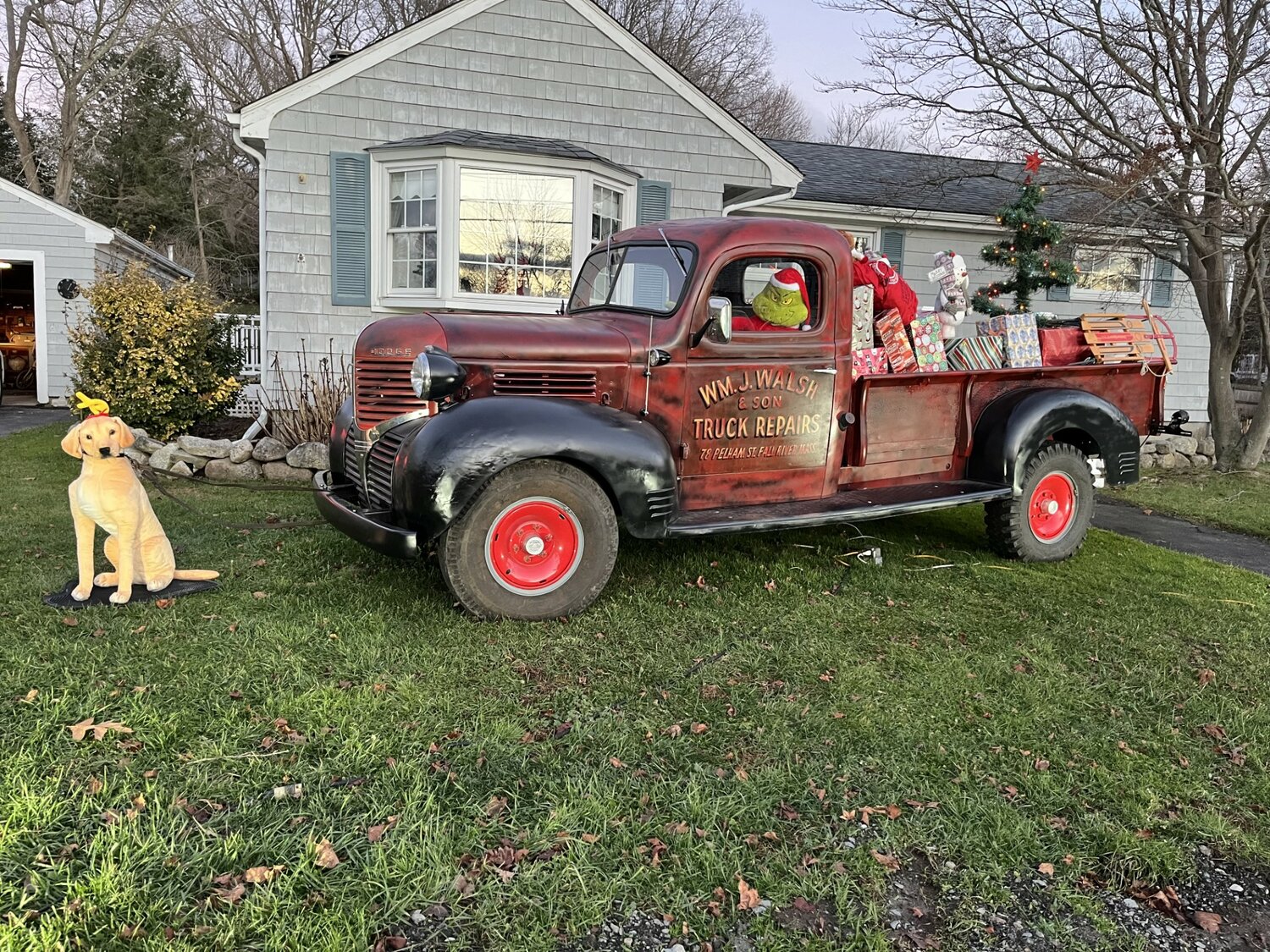 The Grinch arrives in style in a 1939 Dodge on Foxhill Ave in